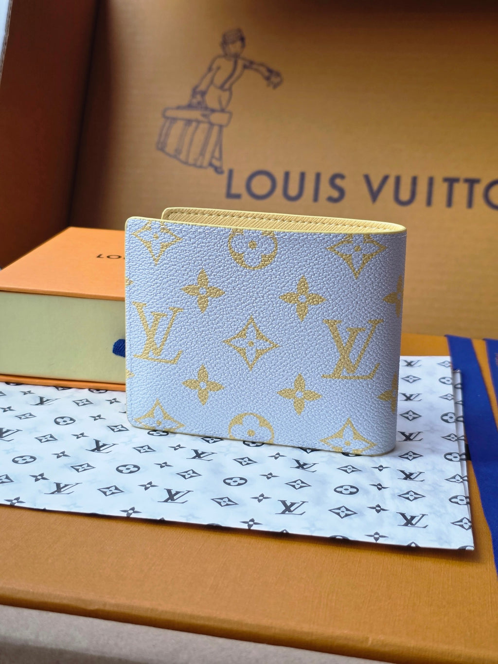 Small card wallet, blue with gold monogram print and curved top corner