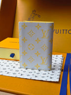 Small bag: yellow card holder with blue monogram pattern, angled front view