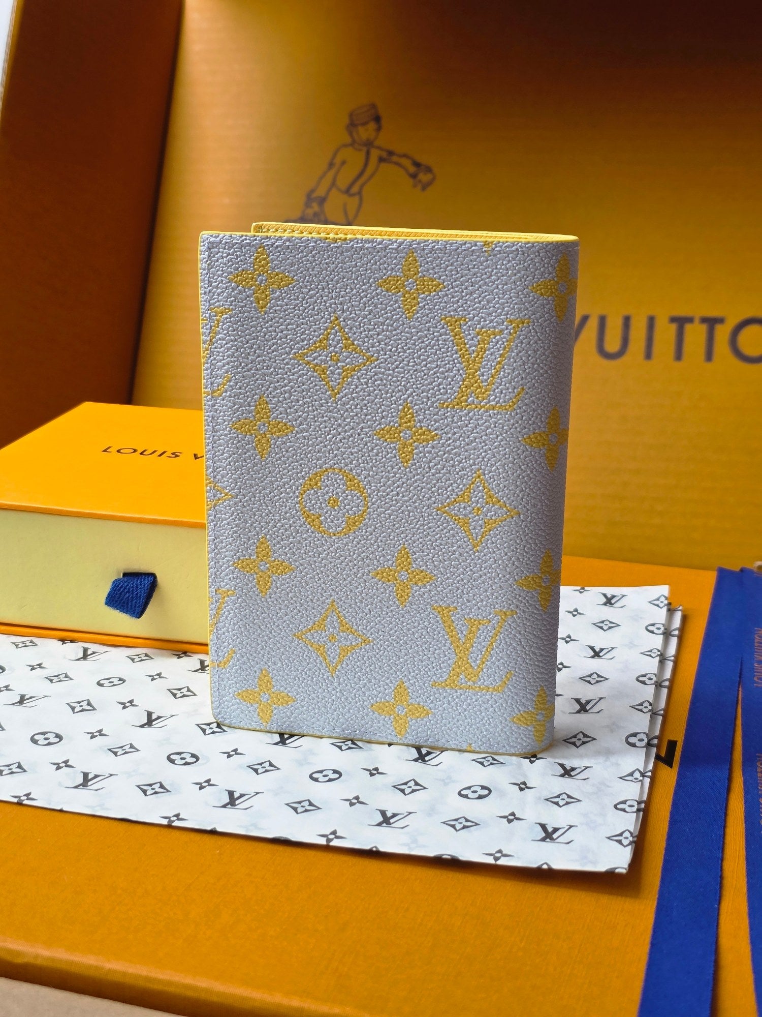 Small bag: yellow card holder with blue monogram pattern, angled front view