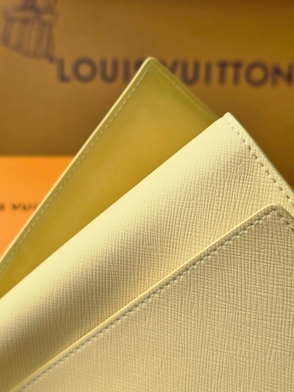 Small bag: yellow leather card case side view with stitched edge