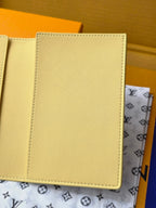 Small bag: yellow card case interior panel with stitching, close-up