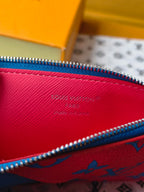 Small bag interior close-up with red lining and blue zipper edge