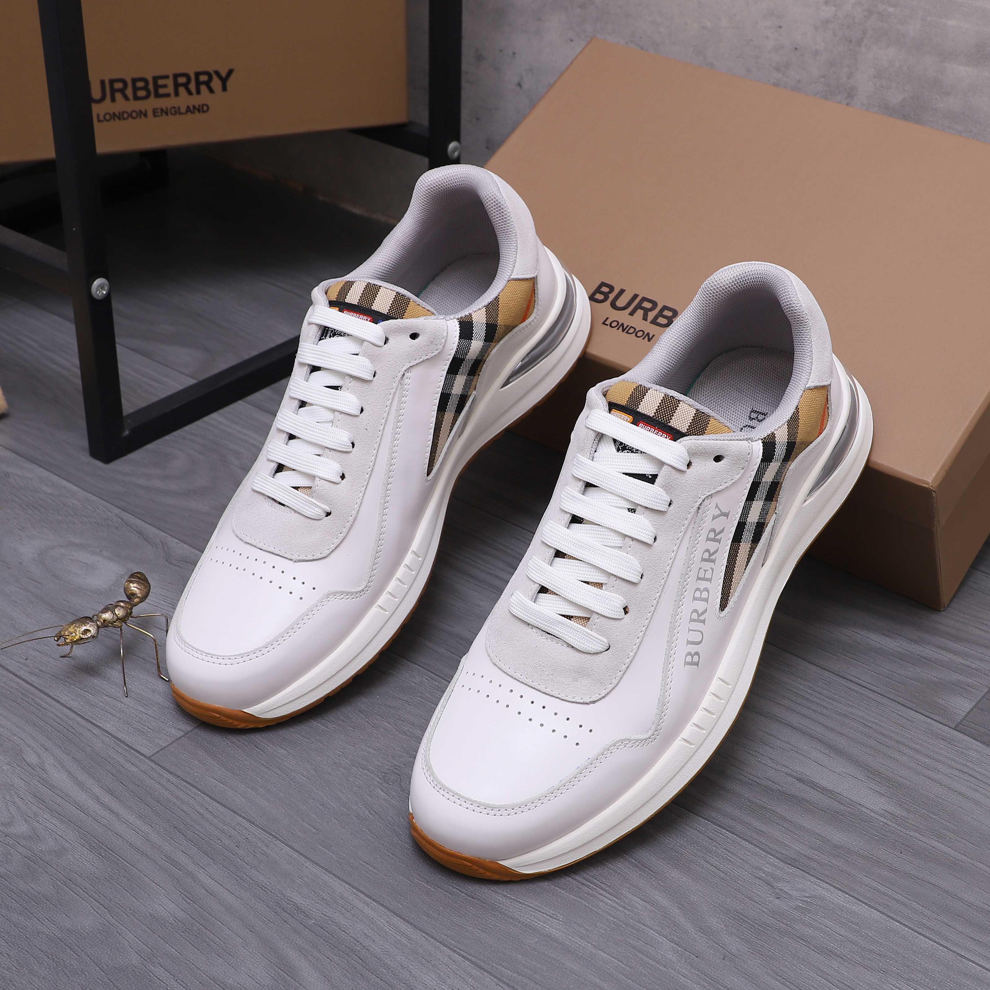 White Burberry low-top sneakers with plaid collar and gum rubber sole
