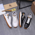 Set of luxury sneakers: white-and-black pair plus black pair with check accents