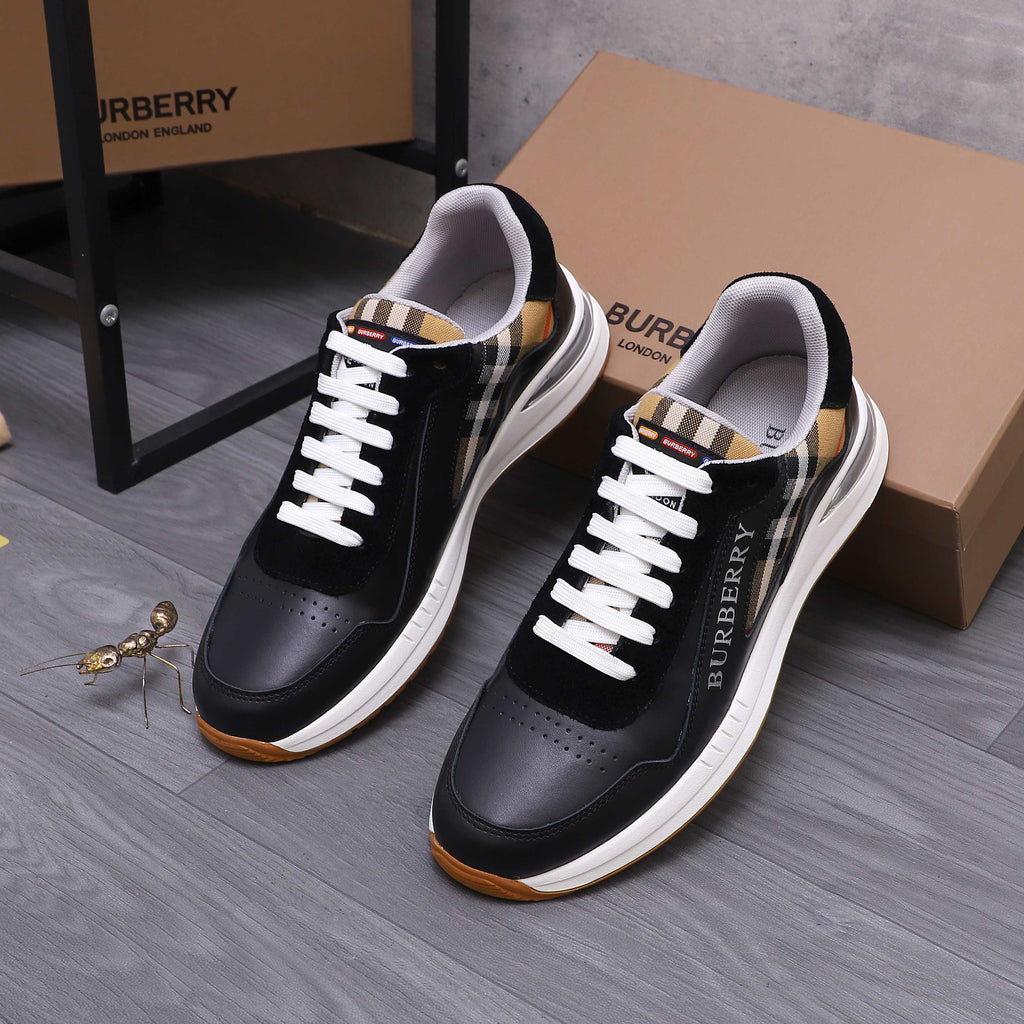 Black luxury sneakers with white laces, check collar lining, and gum-toned sole edge