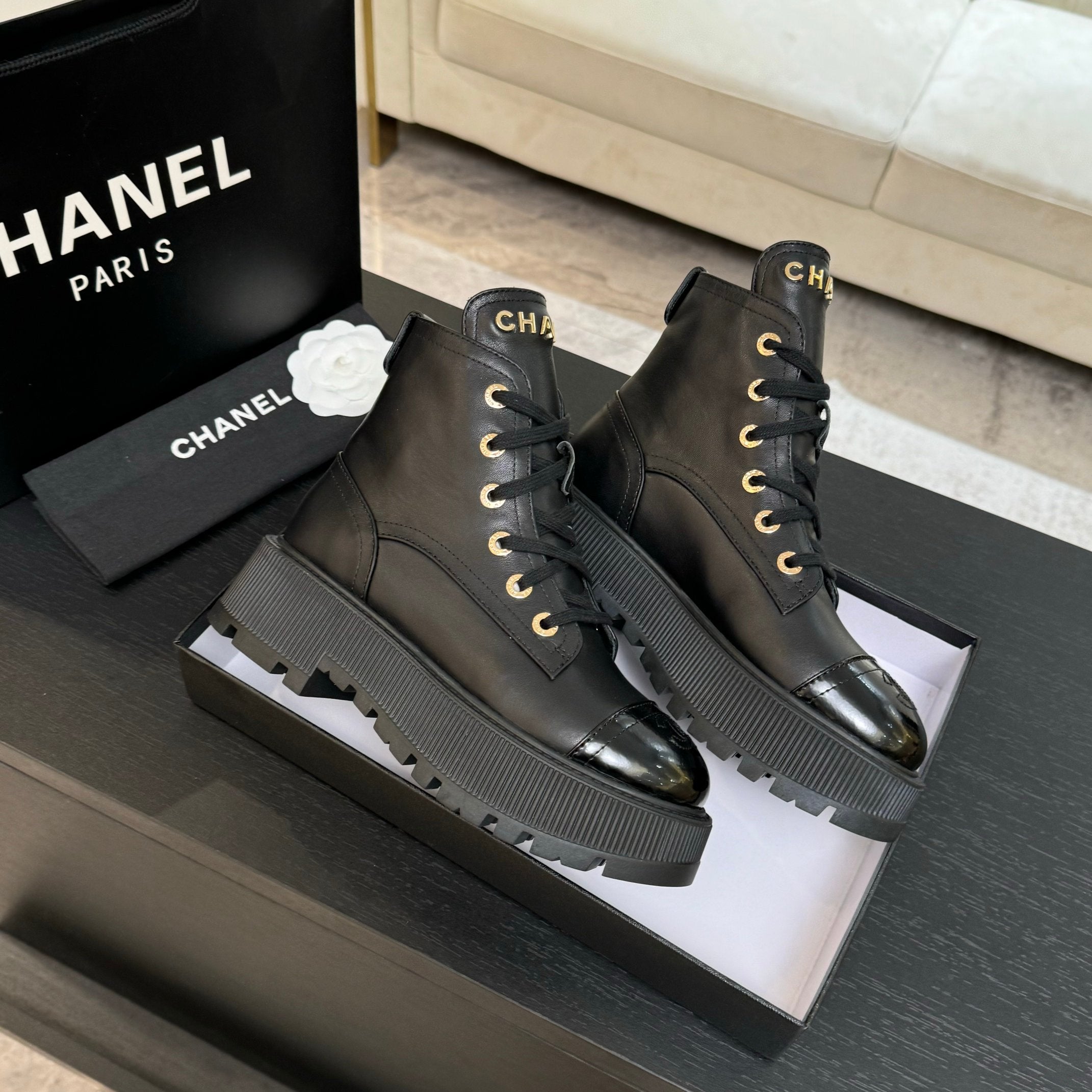 Chanel black leather lace-up ankle boots with ribbed platform sole edges