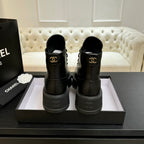 Chanel black leather lace-up ankle boots with back pull tabs on platform soles