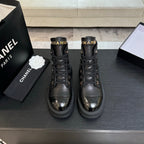Chanel black leather lace-up ankle boots with platform lug soles, gold eyelets