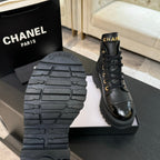 Chanel black leather ankle boot sole close-up with tread pattern and platform