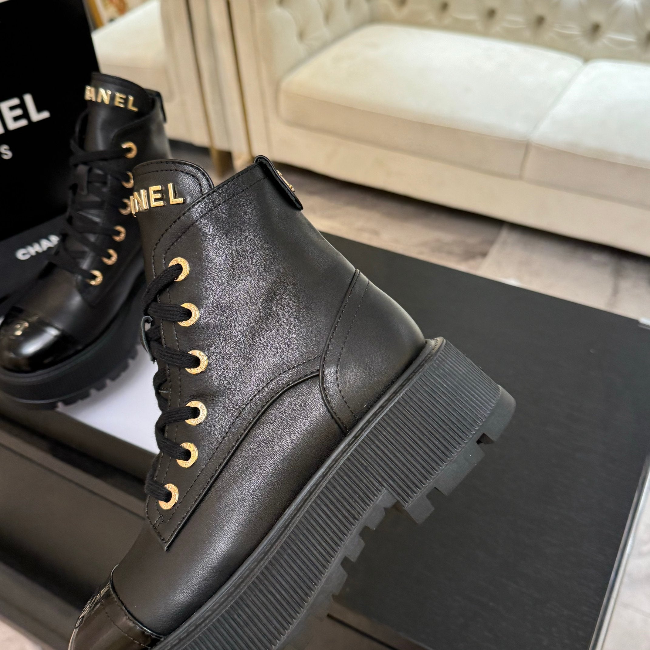 Chanel black leather lace-up ankle boot with ribbed platform heel and outsole
