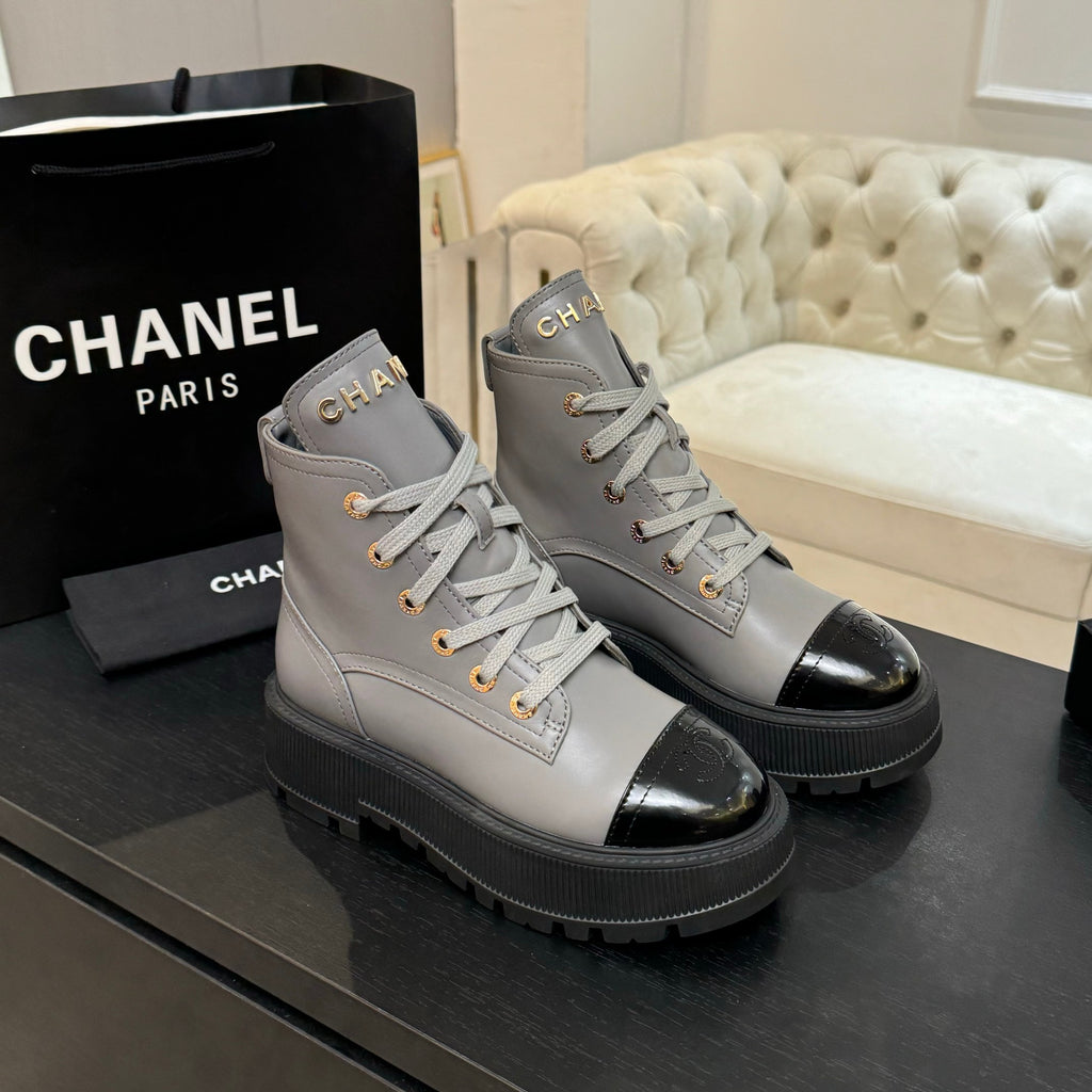 Chanel ladies high-top sneakers in light gray with black toe cap, lace-up design