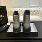 Chanel ladies high-top sneakers, back view in light gray with Chanel heel emblem