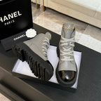 Chanel ladies high-top sneakers, light gray uppers with black toe caps and thick tread soles