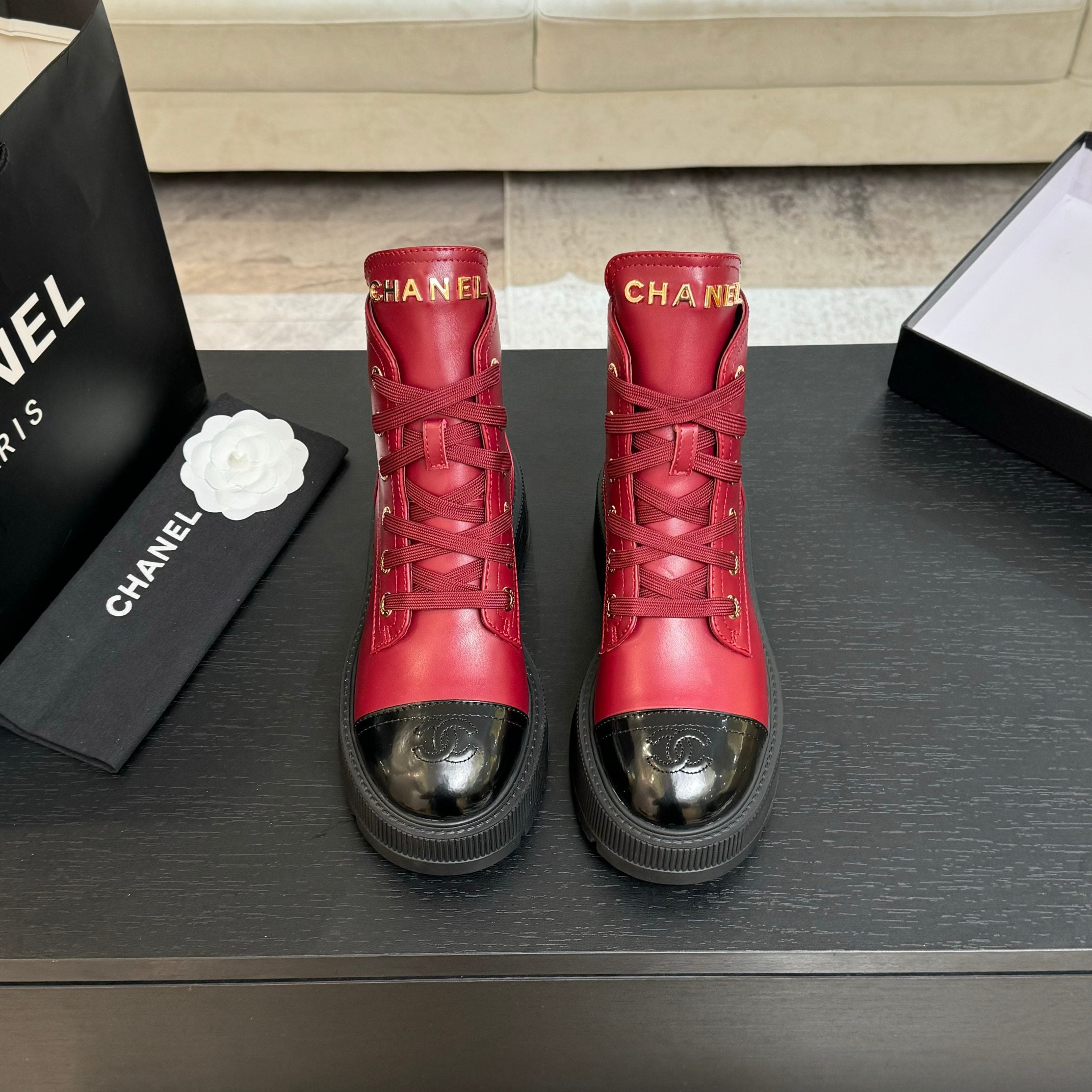 Chanel ladies red lace-up high-top boots with gold eyelets and black rubber soles