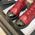 Chanel ladies red lace-up high-top boot close-up with gold laces and rubber platform