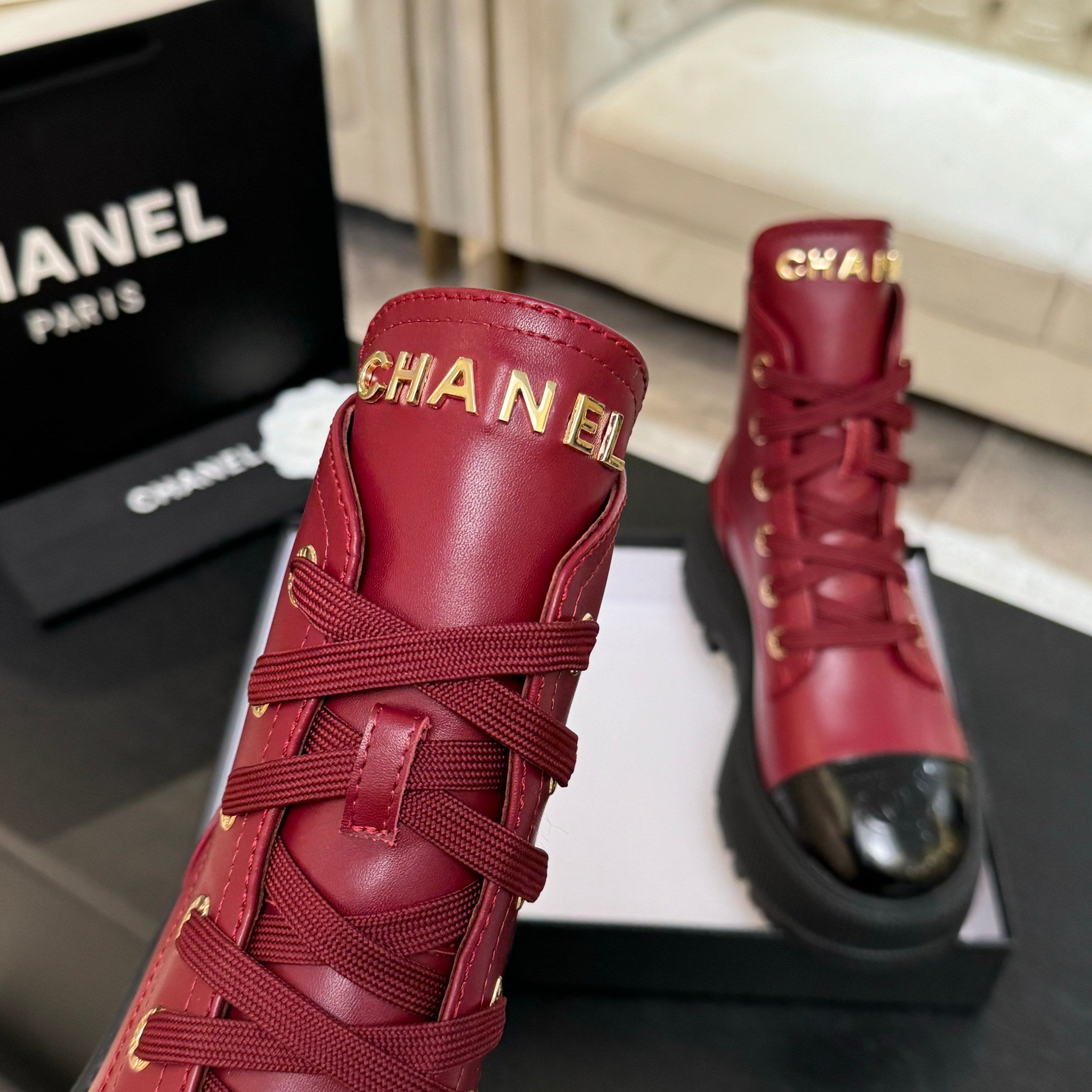 Chanel ladies red lace-up boots with embroidered ankle detail and black rubber soles
