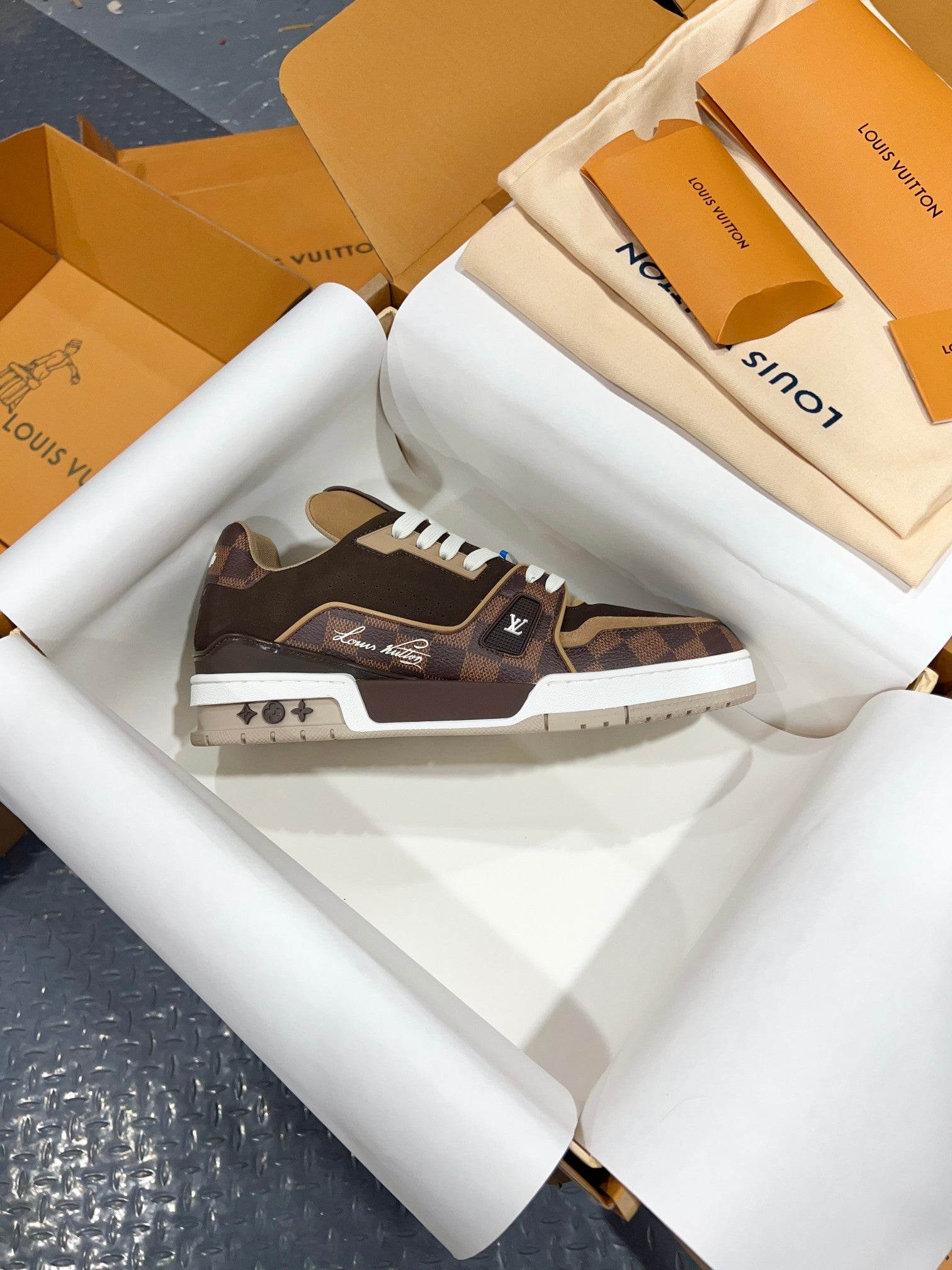 Louis Vuitton trainer sneakers, dark brown with camo details, white laces and textured sole