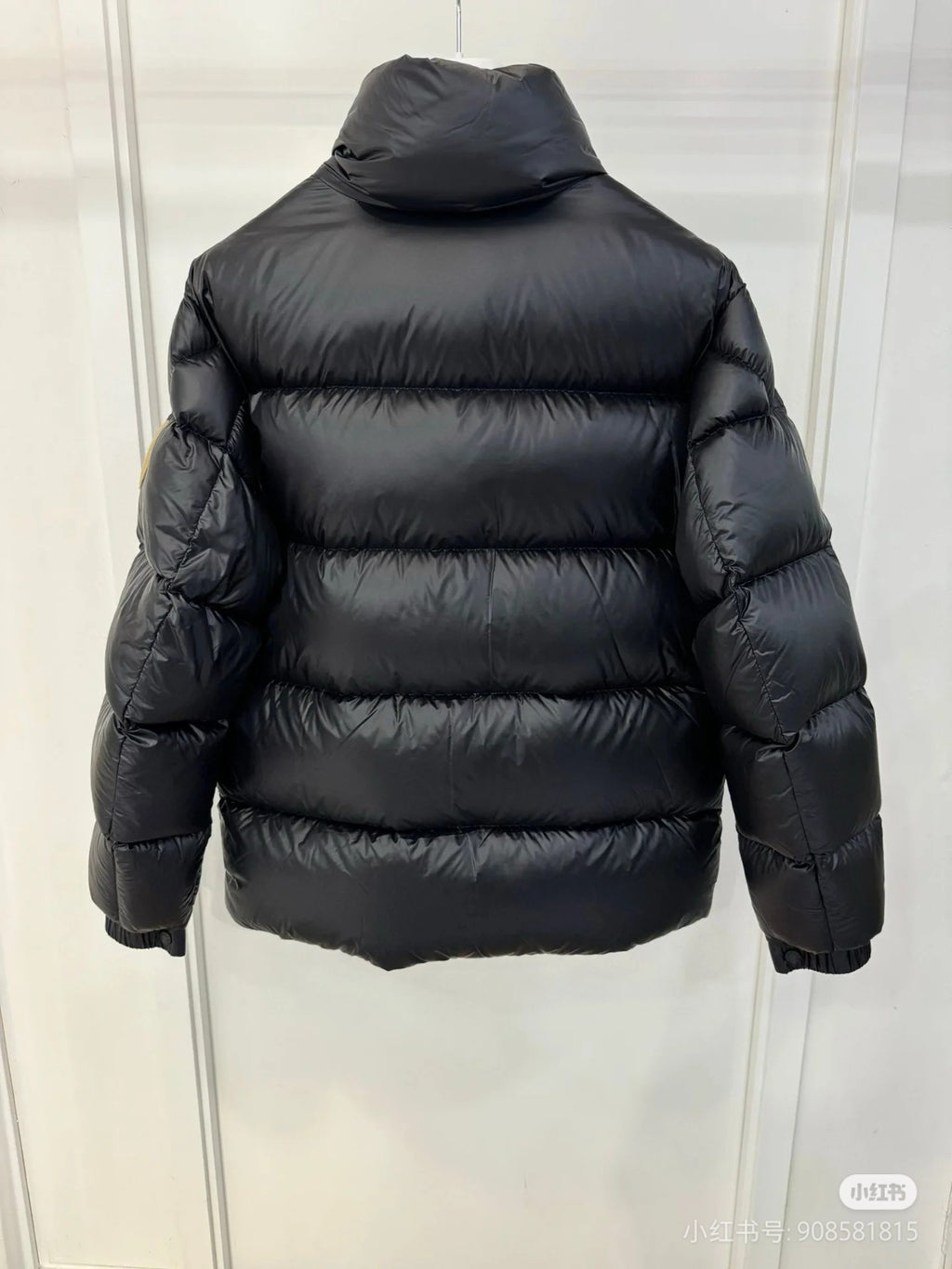Moncler long puffer jacket with hood, dark quilted back, full zipper front, sleeve cuffs