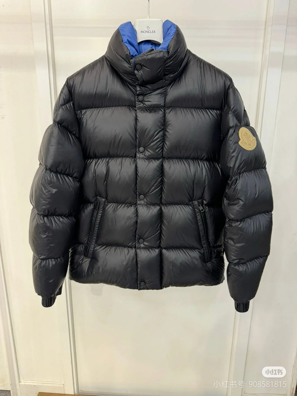 Moncler long puffer jacket with hood, dark quilted fabric, front zipper, sleeve logo patch