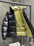 Moncler long puffer jacket with hood, dark sleeves and lime inner layers, front zipper