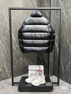 Moncler long puffer jacket with hood, dark horizontal quilting, front zipper, sleeve logo