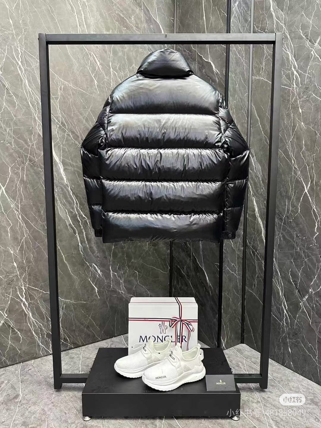 Moncler long puffer jacket with hood, dark horizontal quilting, front zipper, sleeve logo