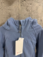 Light blue hooded sweatshirt with front zipper and small chest logo