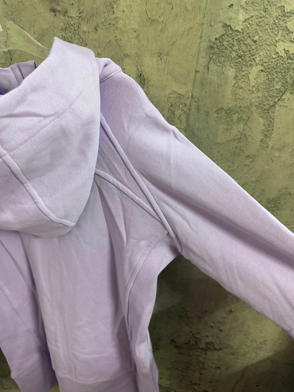 Light purple zip-up hoodie with long sleeves and soft drape