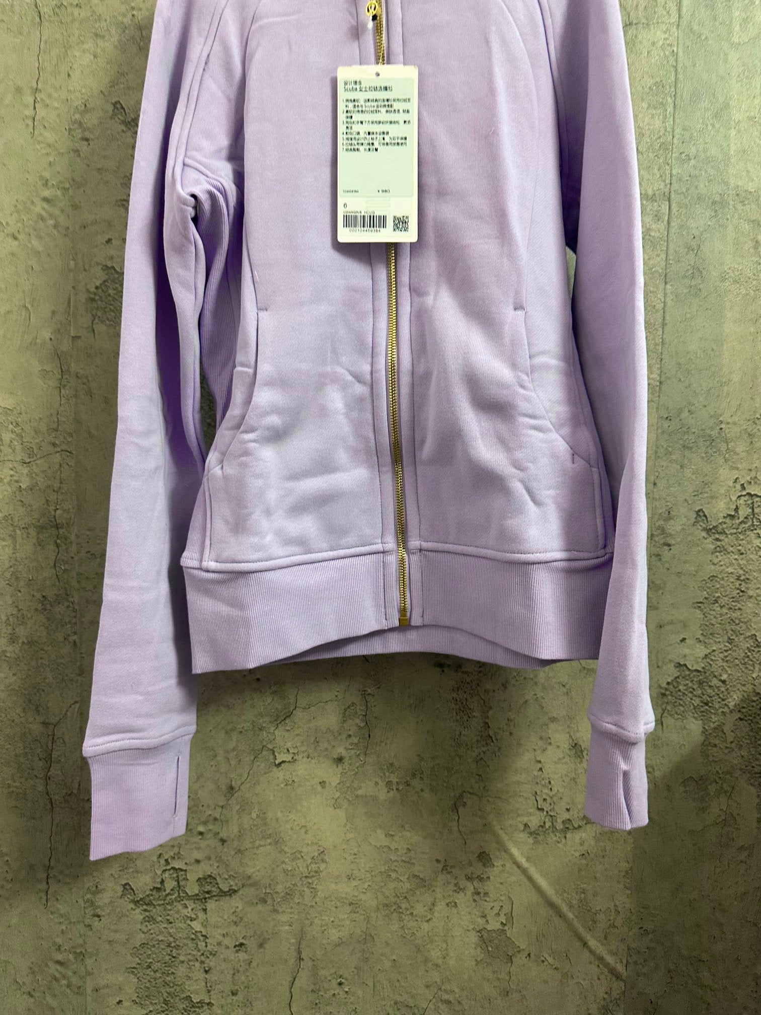 Light purple zip-up hoodie with kangaroo pocket and front zipper