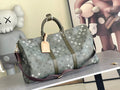 Louis Vuitton duffel bag in dark gray monogram canvas with top handles and leather trim
