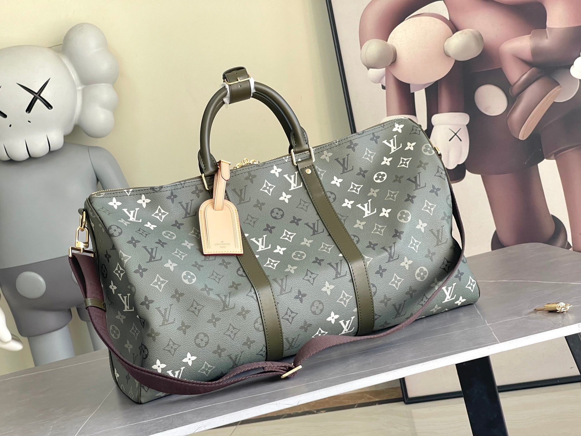 Louis Vuitton monogram duffel bag with dark green canvas and tan leather trim, top handles