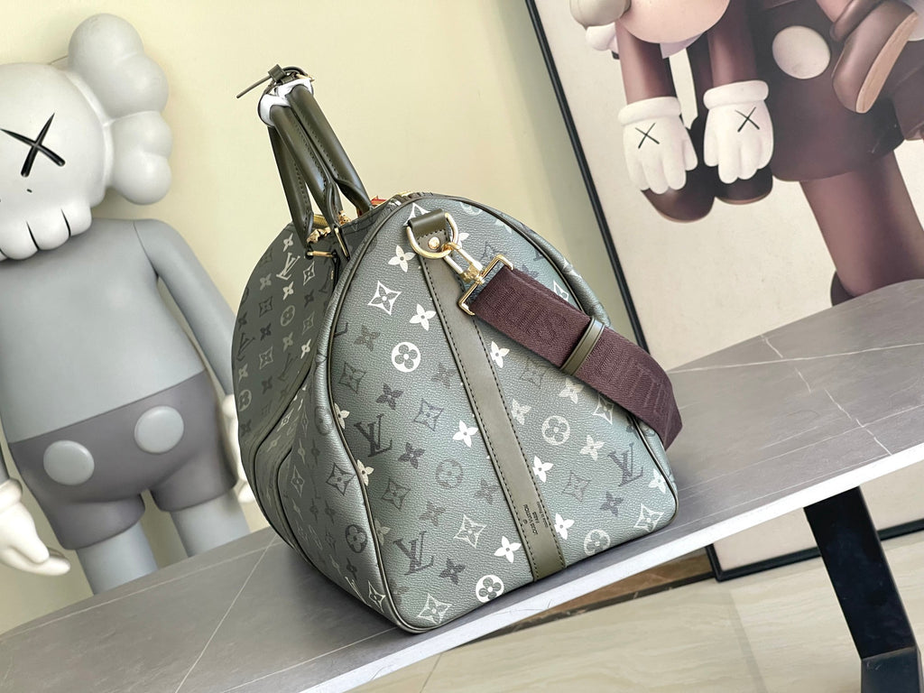 Louis Vuitton duffel bag side view in dark gray monogram canvas with zipped top