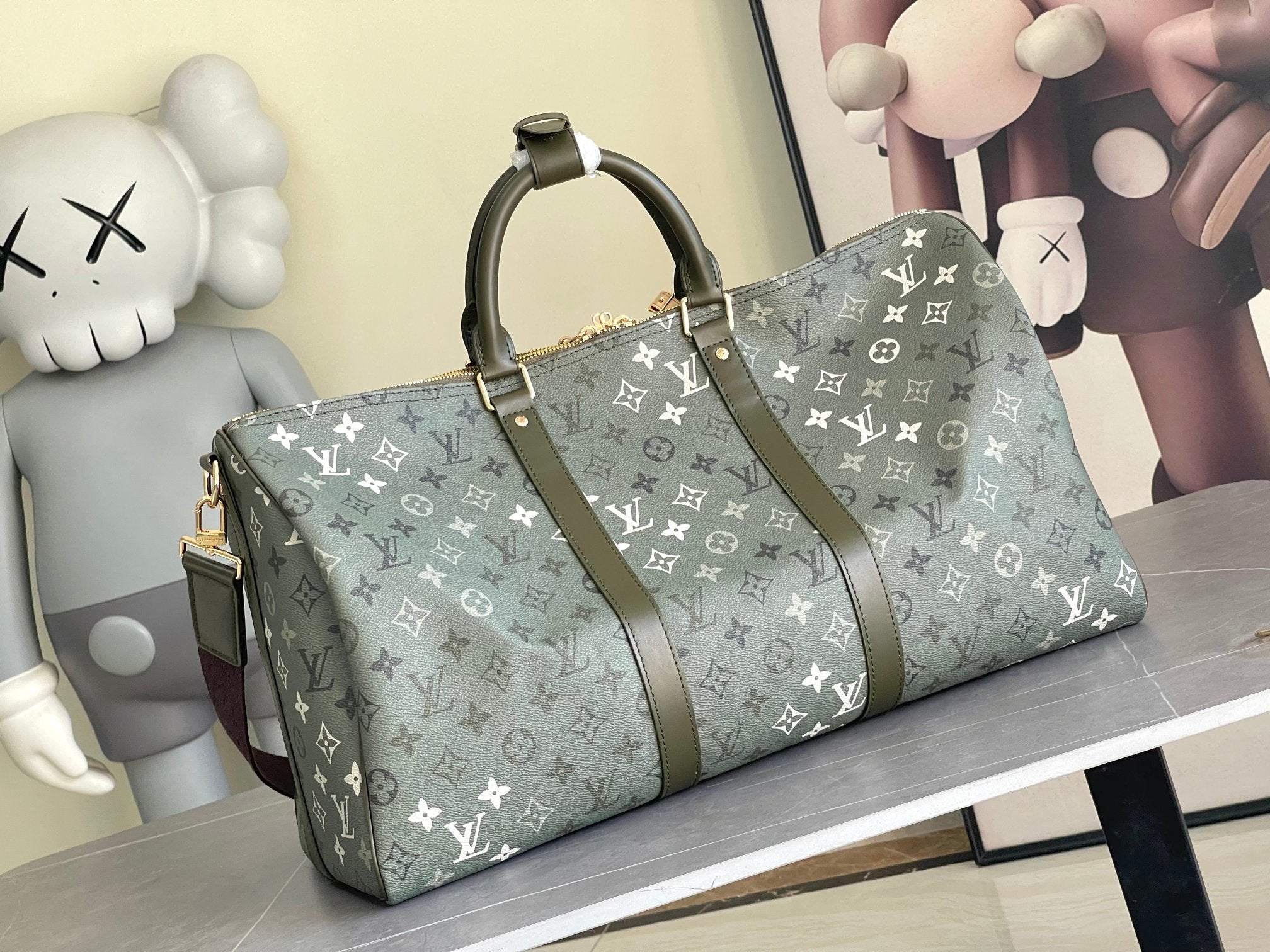 Louis Vuitton duffel bag angled view in dark gray monogram canvas with top handles