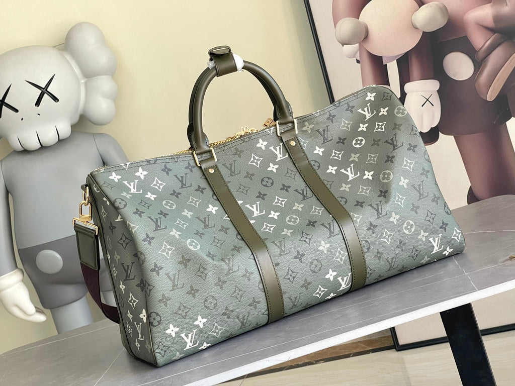Louis Vuitton monogram duffel bag in dark green canvas with wide leather handles and trim