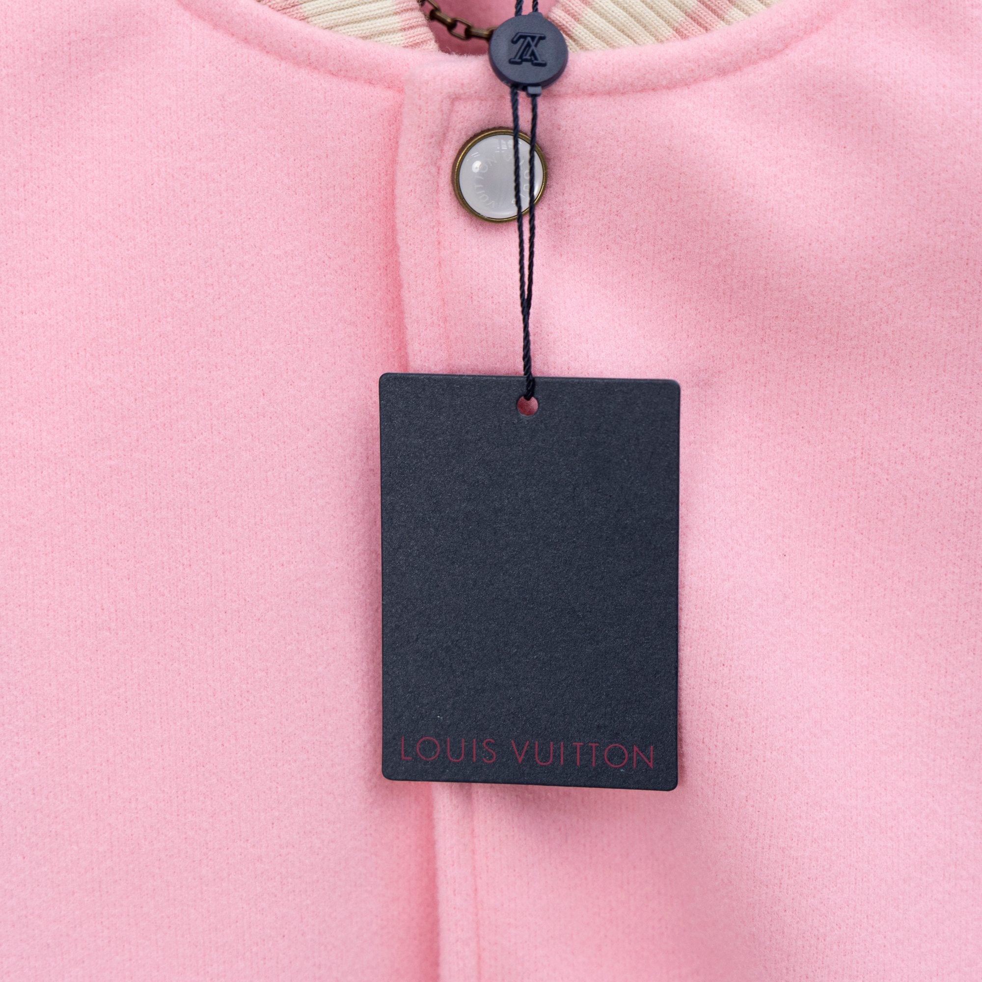 Pink collar with snap button and Louis Vuitton hang tag