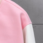 Pink fabric sleeve with ribbed white cuff