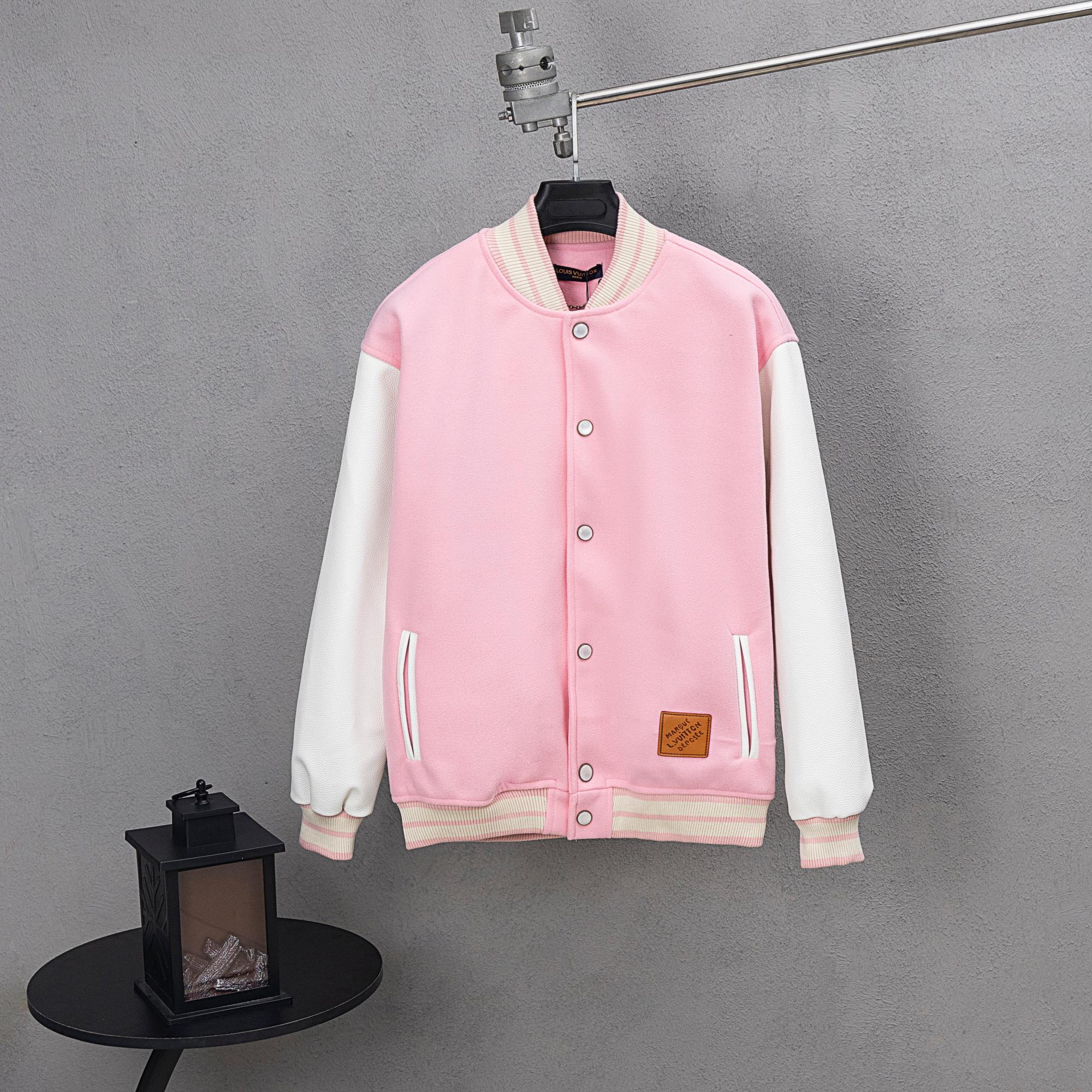 Pink varsity-style jacket with snap buttons and white-striped ribbed cuffs