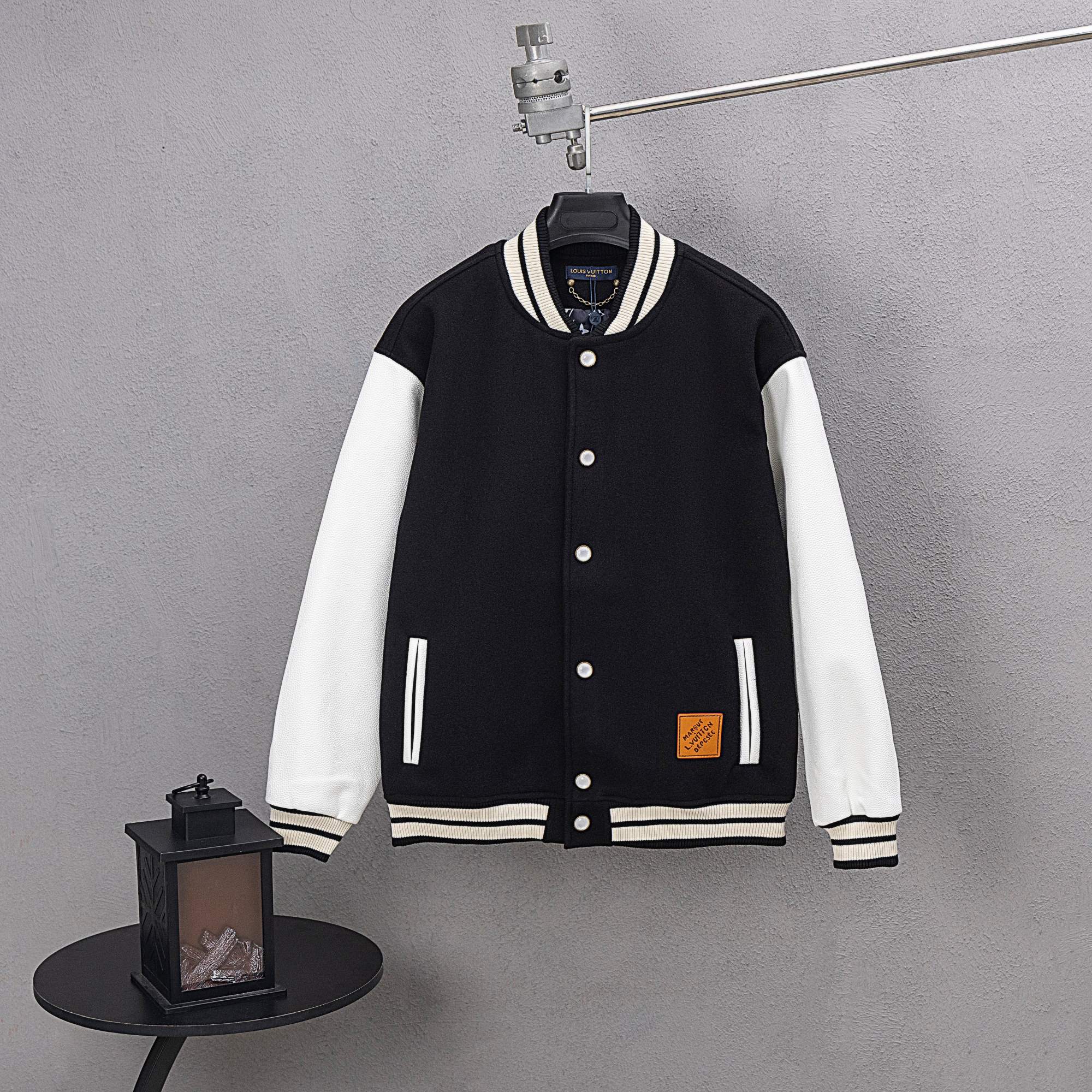 Louis Vuitton black varsity jacket with white striped collar and front snap buttons