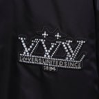 Louis Vuitton jacket front with large rhinestone crown logo