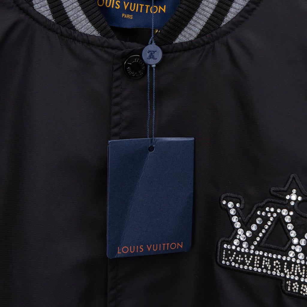 Louis Vuitton jacket front placket with button and rhinestone crown emblem