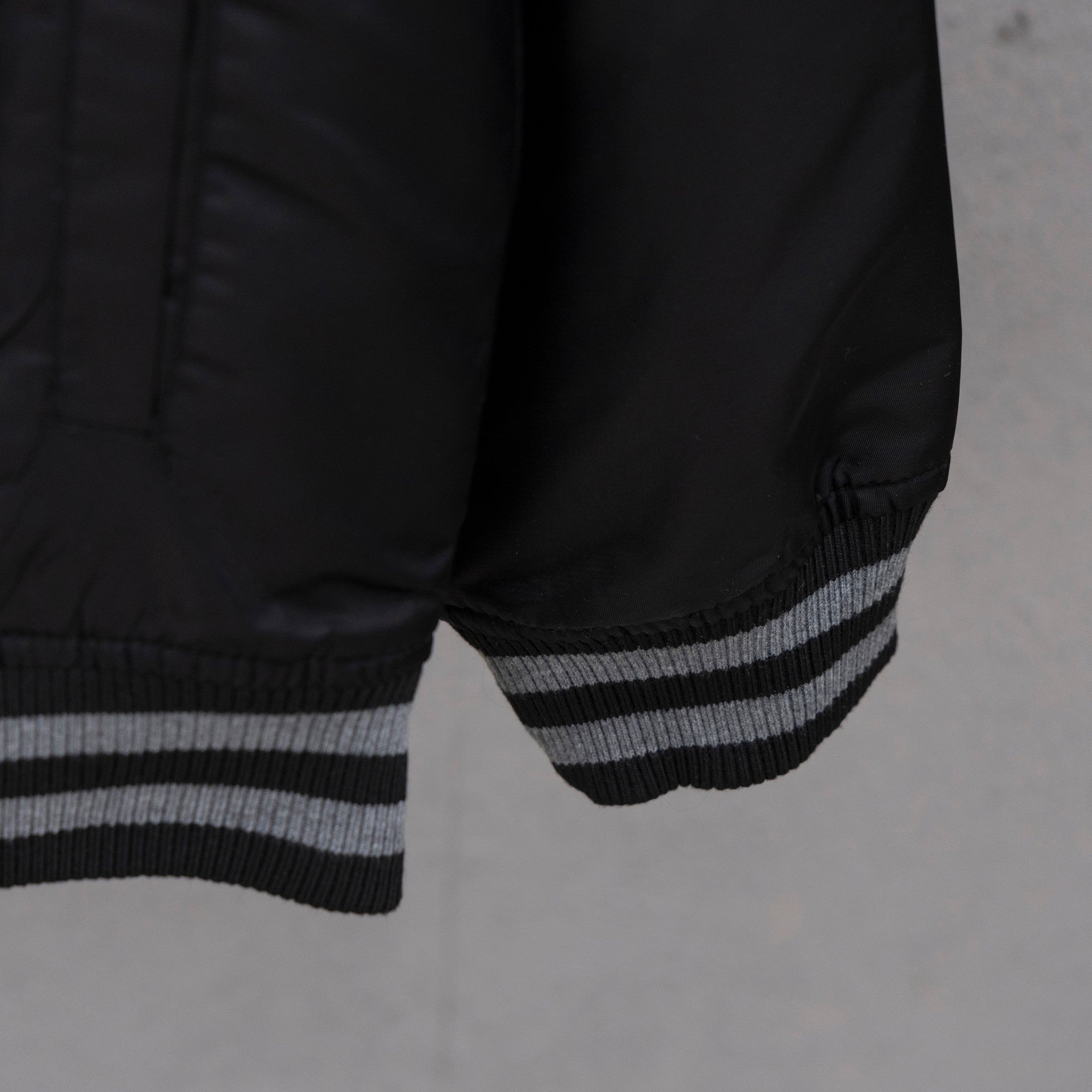 Louis Vuitton bomber jacket hem and sleeve cuff with striped rib knit