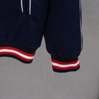 Dark navy jacket hem with red/white striped ribbed cuffs