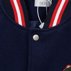 Navy jacket collar with red/white striped ribbing and Dior neck label