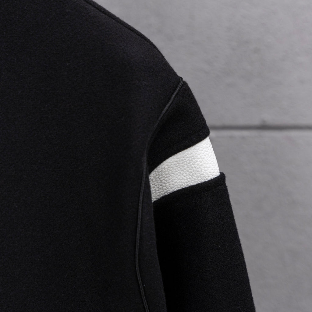Givenchy button-up jacket sleeve detail, black with white striped rib cuff