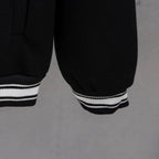 Givenchy button-up jacket sleeve, black with white striped ribbed cuff hem