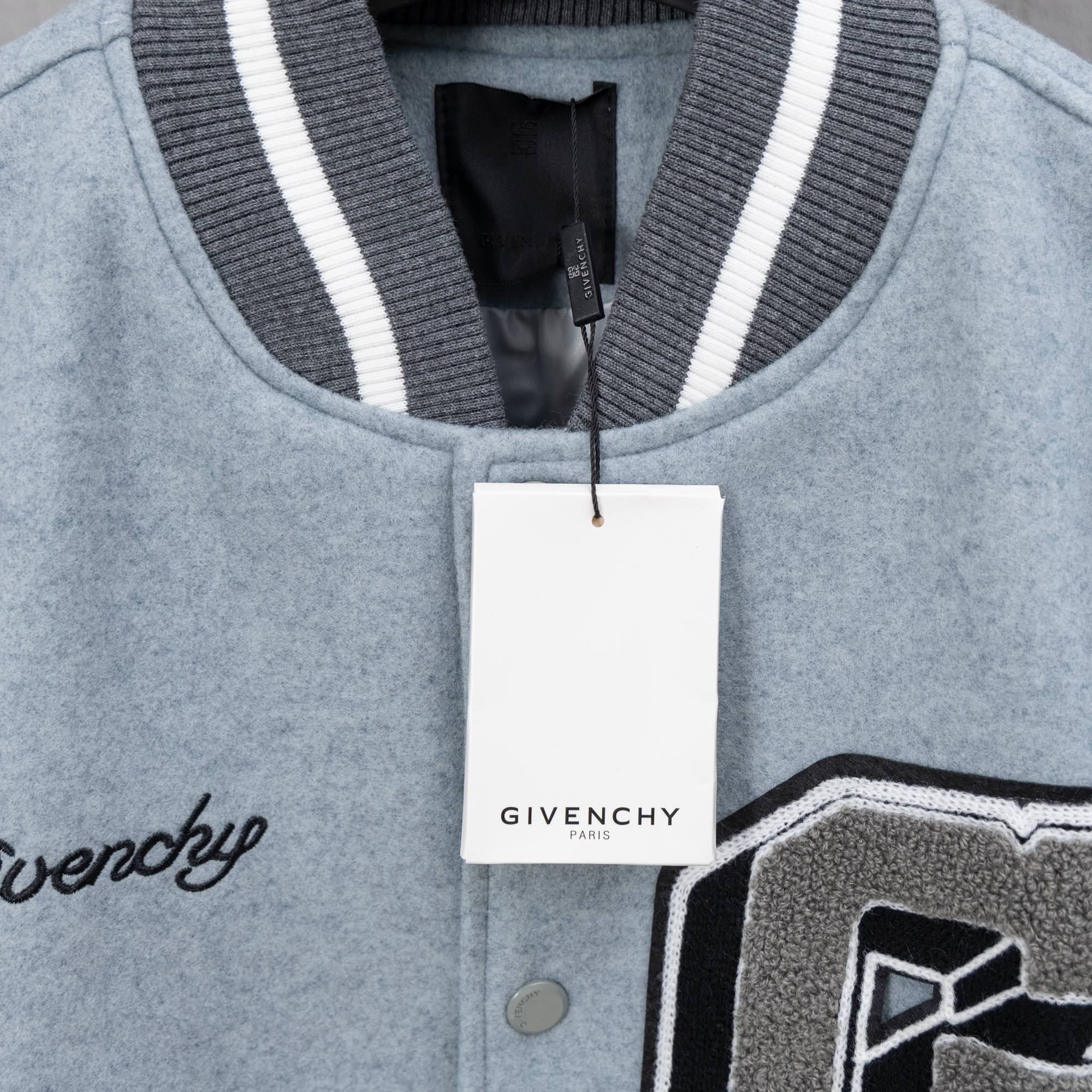 Givenchy varsity jacket neckline with ribbed collar stripes and black inner placket; snap button
