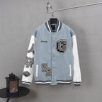 Givenchy light-blue varsity jacket, white sleeves, striped ribbed collar, snap front, patches