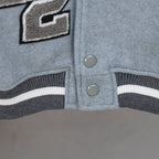 Givenchy light-blue varsity jacket hem with striped ribbing and round snap buttons