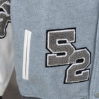 Givenchy varsity jacket side patch with bold S graphic and black-bordered applique