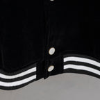 Black jacket front with snap buttons and double white striped ribbed hem